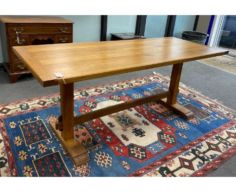 An Arts and Crafts style rectangular light oak refectory dining table, length 183cm, width 76cm, height 76cm