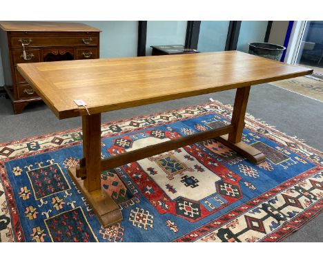 An Arts and Crafts style rectangular light oak refectory dining table, length 183cm, width 76cm, height 76cm