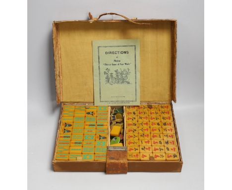 A leather cased Bakelite mahjong set