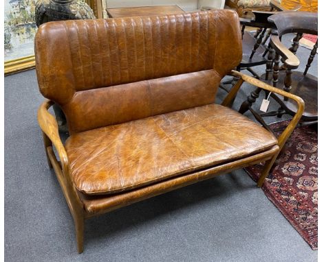 A Laura Ashley Whitworth oak and leather sofa, length 121cm, width 60cm, height 87cm