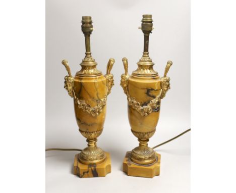A pair of neo classical revival gilt metal and Siena marble lamps, 43cms high including light fitting