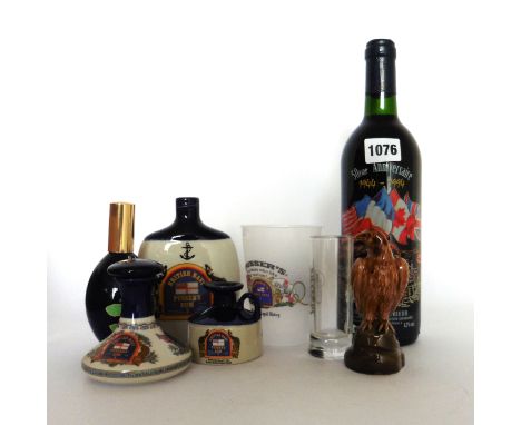 A collection of Pusser's Rum small ceramic decanters (empty), glasses, enamelled tin cup, a Beneagles Beswick Eagle miniature