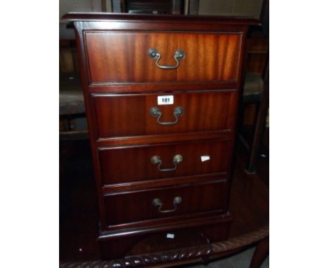 A 17" reproduction mahogany four drawer bedside chest, set on bracket feet