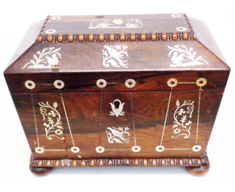 An antique rosewood sarcophagus tea caddy with inlaid mother-of-pearl decoration, set on bun feet - lining missing