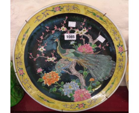An Japanese late Meiji period Famille Noire charger depicting peacock and hen among chrysanthemum and prunus - diameter 14 1/