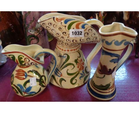 Three pieces of Aller Vale Pottery comprising a Persian pattern jug, another and a vase