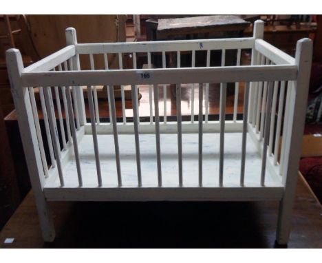 A 29 1/2" vintage painted wood cot - sold as a collector's item only