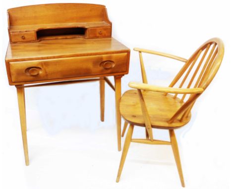 A 26" Ercol light elm Windsor desk, the raised back with shelf, recess and flanking trinket drawers over a long frieze drawer