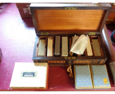 A Tunbridge ware playing card box (a/f) containing seven decks and two whist markers - sold with three Canasta sets