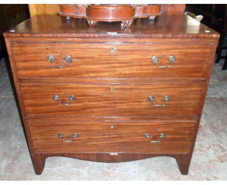 A 36" 19th Century mahogany chest of three long graduated drawers, set on raised bracket feet