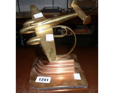 A mid 20th Century brass and copper model of a twin-engine aircraft on Art Deco style base
