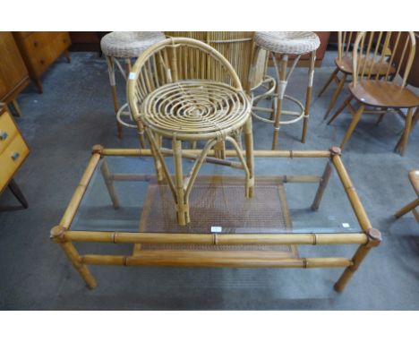 A G-Plan simulated bamboo and glass topped coffee table and a small bamboo stool 