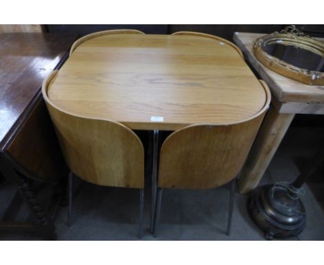 A light oak kitchen table and four chairs 