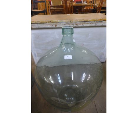 A vintage glass carboy 