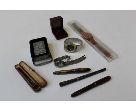 A selection of collectables, featuring a commemorative Cutty Sark zippo lighter, two vintage fountain pens, both with 14k nib