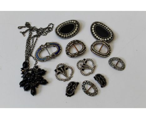 Five pairs of Edwardian paste set buckles, a single paste and enamel buckle and a polished black hardstone bead necklace