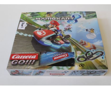 A complete ' Mariokart' slot racing system 1:43 scale ( Track, cars, controllers etc) Very good condition)