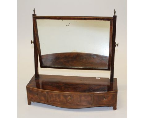 A 19th century mahogany toilet mirror with adjustable rectangular plate, three drawer box base on bracket feet, 54cm wide