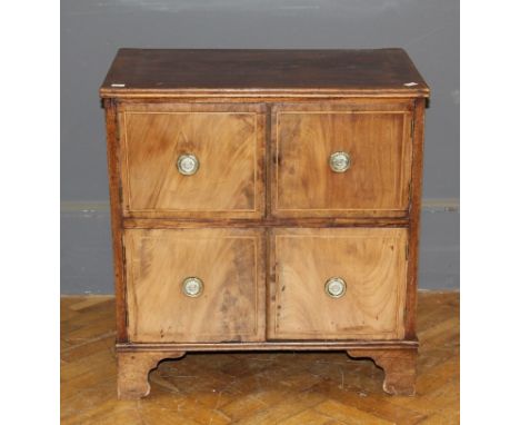 A George III mahogany night cupboard, fitted two pairs of strung doors, on bracket feet, 67cm wide