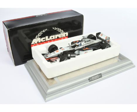 Minichamps 1/18th scale 530 981808 McLaren Mercedes MP4/13 M. Hakkinen, complete with GP Legends 1998 World Champion Plinth. 