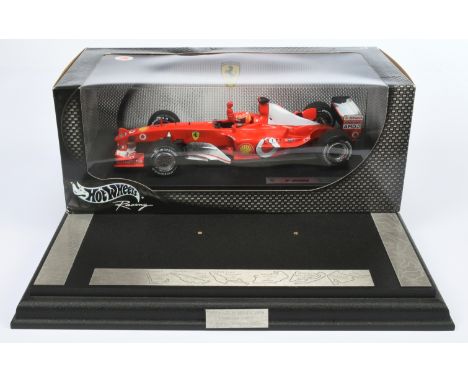 Hot Wheels 1/18th scale 54626 Ferrari M. Schumacher F 2002, also includes F 2002 World Champion MDF display plinth with metal