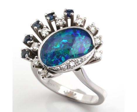 White gold 585, 9 g. Beautiful, floral designed ring, the front side set with an opal cabochon ca. 13.5 x 11 x 3.5 mm, 5 sapp