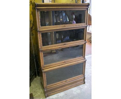 GLOBE WERNICKE BOOKCASE, early 20th century oak with four stacking glazed sections stamped 'Globe Wernicke', 87cm W x 30cm D 