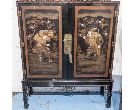 SIDE CABINET, late 19th/early 20th century Japanese black lacquer and gilt of two doors decorated in relief with ivory and mo