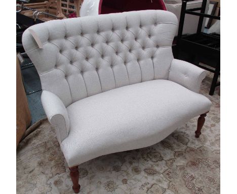 SOFA, small two seater, in button back neutral fabric on turned supports, 121cm L.