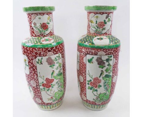 PAIR OF ORIENTAL CERAMIC VASES, decorated birds amidst flowering boughs in colours, 44cm H. (2)