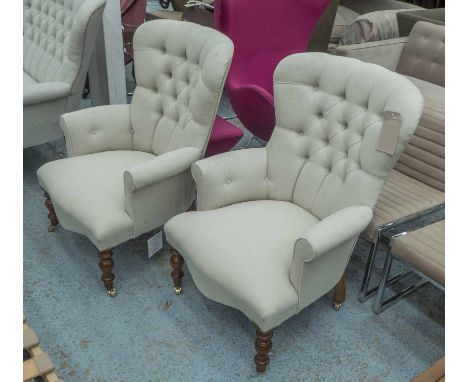 ARMCHAIRS, a pair, button back in neutral fabric on turned castor supports, 68cm W. (2)