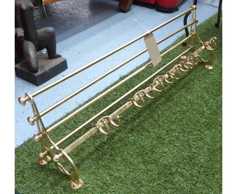 WALL MOUNTED COAT RACK, and shelf, in brass, 96cm L. 