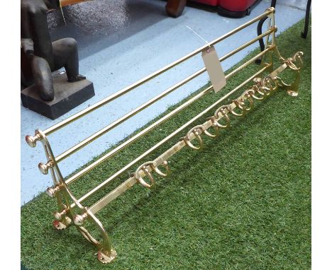 WALL MOUNTED COAT RACK, and shelf, in brass, 96cm L. 