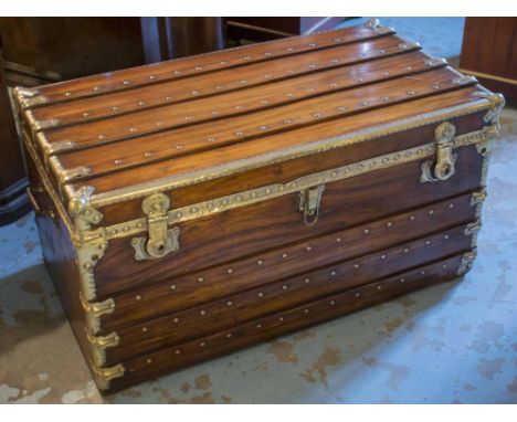 TRUNK, 19th century camphorwood and brass bound, brass studded and battened throughout with rising lid and carrying handles, 