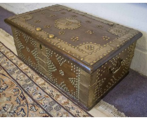 ZANZIBAR TRUNK, hardwood of small size, with hinged top, metal bindings and studding, 56cm W x 35cm D x 24cm H.