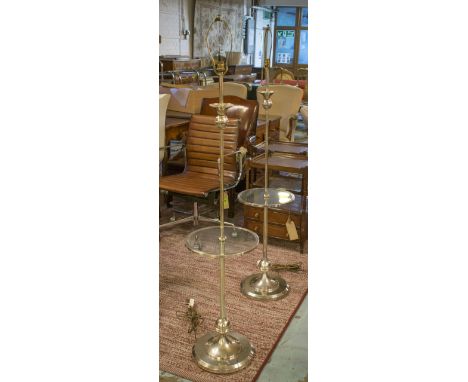 STANDARD LAMPS, a pair, Art Deco design silvered each with circular base, glass shelf and shade, 153cm H. (2)