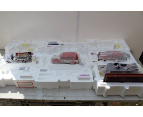 A COLLECTION OF FOUR THE FRANKLIN MINT PRECISION MODELS,  1946 Chevy suburban ambulance limited edition, a 1956 Chevrolet Nom