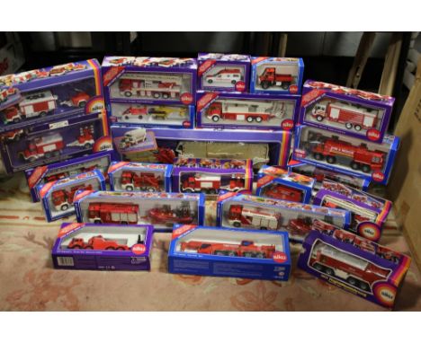 TWENTY TWO BOXED SIKU VEHICLES, mostly fire related, mixed scales 1:50, 1:55, 1:87 