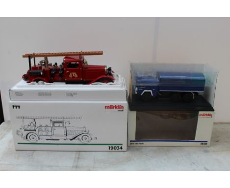 MARKLIN - TWO BOXED DIE CAST VEHICLES, comprising Marklin Metall 19034 clockwork fire engine and Marklin LKW MIT plane 18101 