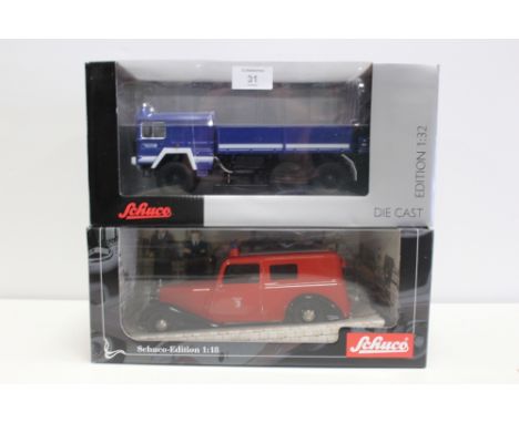 A SCHUCO 1:18 SCALE LIMITED EDITION MECEDES BENZ FIRE VAN, together with Schuco 'ManKatai 6 x 6 THW' fire truck (2)