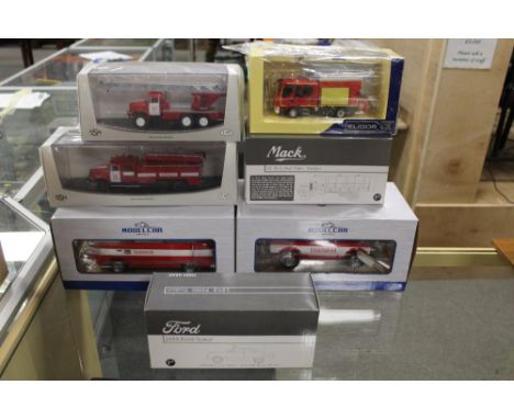 A BOX CONTAINING TWO MODEL CAR 1:18 SCALE EMERGENCY SERVICE VEHICLES, together with two First Gear vehicles, an Eligor 1:43 s