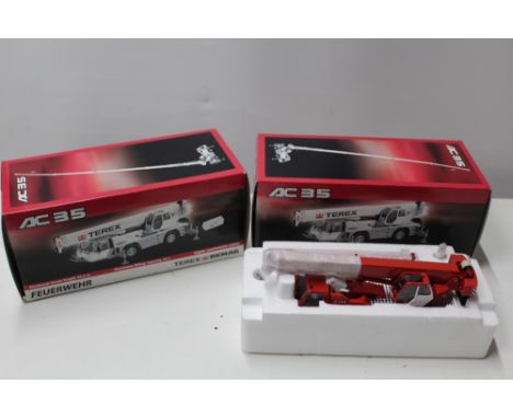 TWO BOXED TEREX DEMAG 1:50 SCALE MOBILE CRANES