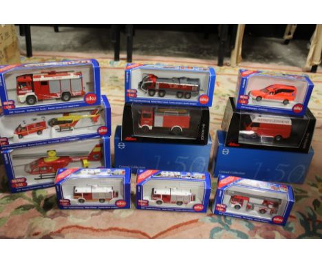 TWELVE BOXED EMERGENCY SERVICES VEHICLES, to include eight by Siku, two Schuco 1:43 scale and two Conrad 1:50 scale