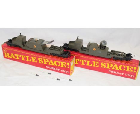 A Triang 00 gauge Battlespace missile launcher with five missiles and a search light wagon, both boxed