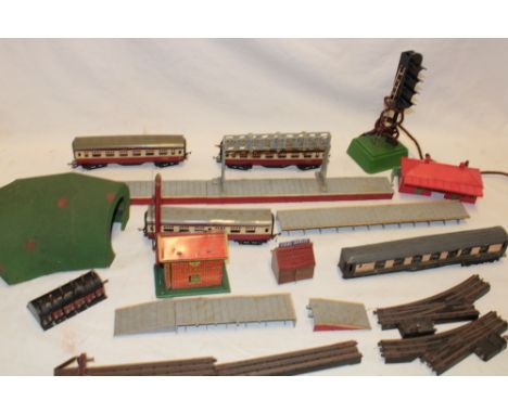 A selection of various 00 gauge railway items together with a Brimtoy signal box, 0 gauge electric signal light, tunnel, sele