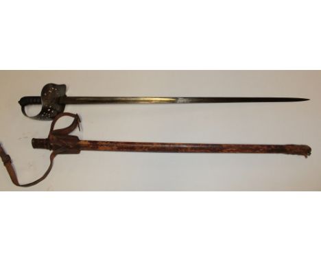A Victorian Warrant Officer's sword with steel blade by Wilkinson, steel guard with wire bound grip in leather scabbard with 