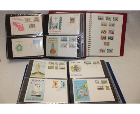An album containing a collection of Isle of Man used stamps together with two albums of Isle of Man first day covers