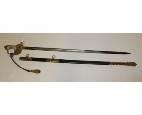 A George VI Royal Naval Officer's sword with etched steel blade by EJ Whittaker of Chatham, gilt hilt with wire bound fish sk
