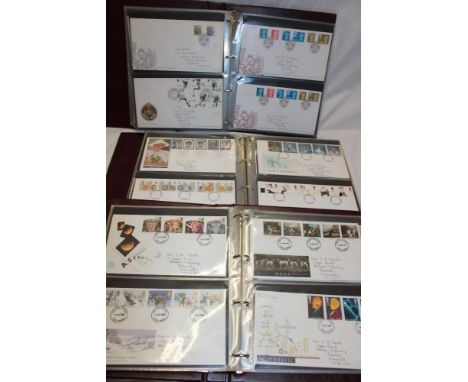 Three folder albums containing a collection of over 200 GB first day covers, 1973-2014