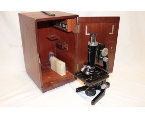 A monocular microscope "The Service II" by W. Watson & Son London in fitted mahogany case